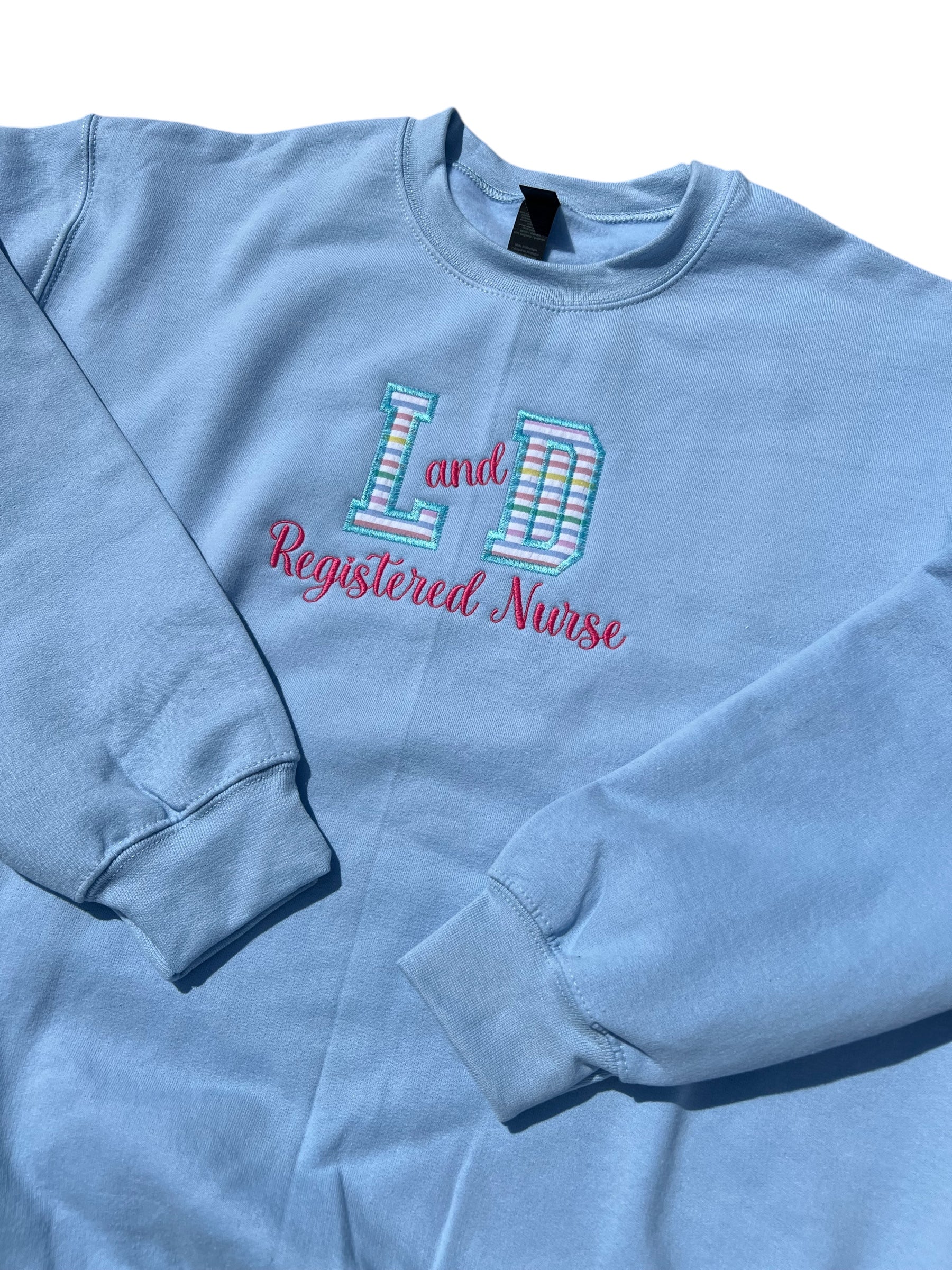 L and D embroidered registered nurse crewneck