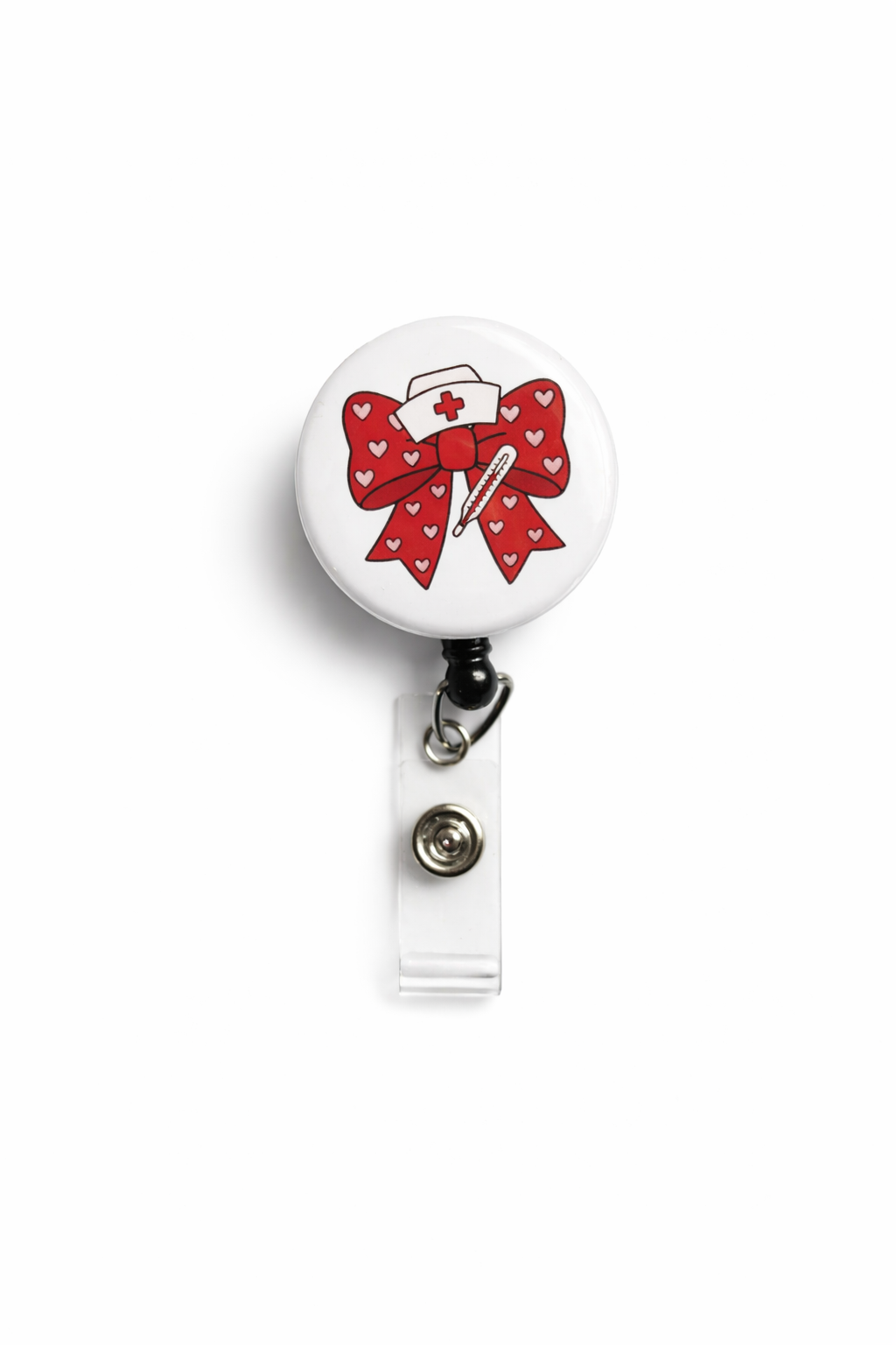 Retractable badge holder with a red bow and nurse hat design on a white background