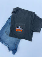 spooky season halloween design with ghost embroidered onto a comfort color pocket tshirt