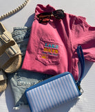 bright pink t0shirt with a pocket with embroiderery that says lake days are the best days