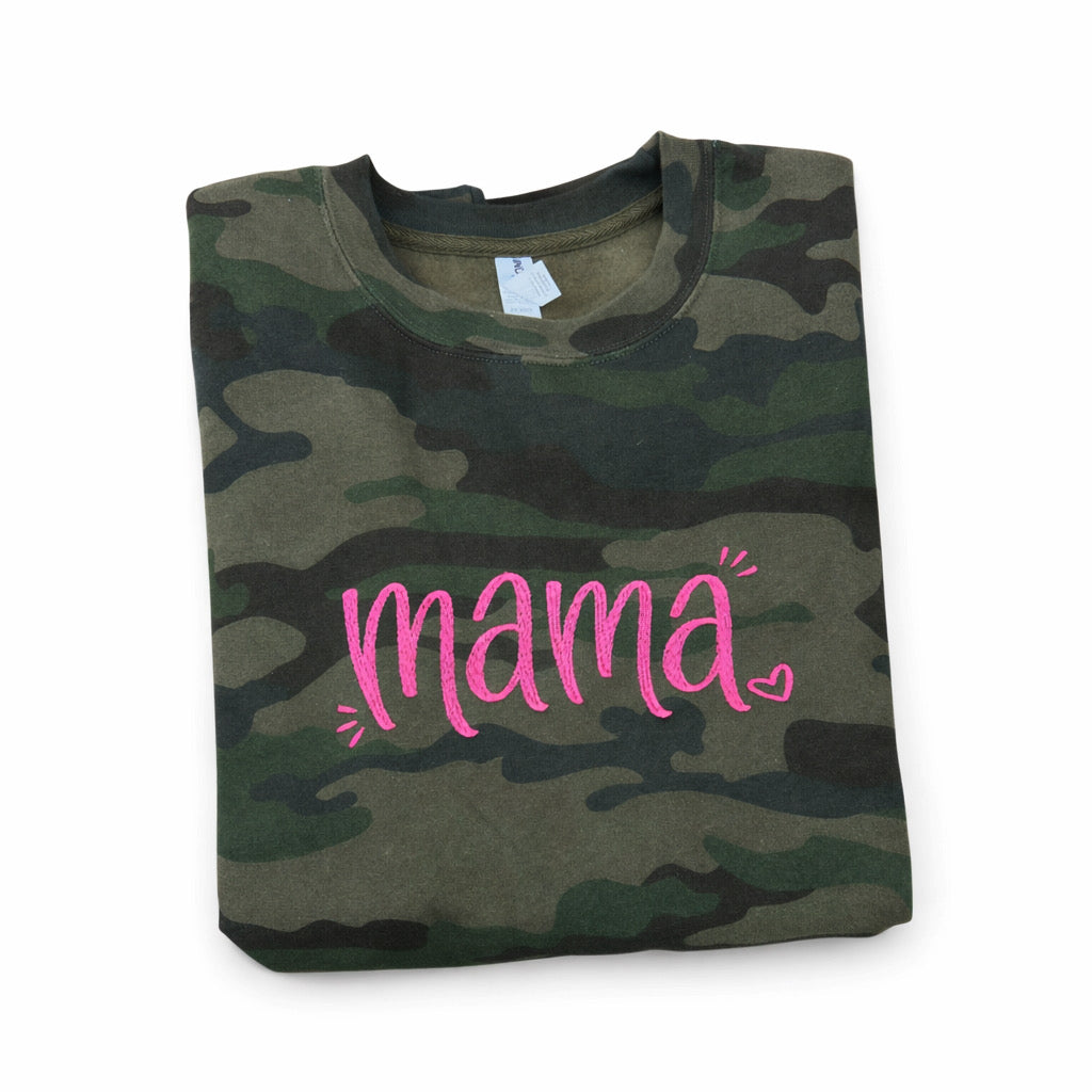 Camouflage shirt with pink 'mama' text on a white background