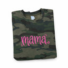 Camouflage shirt with pink 'mama' text on a white background