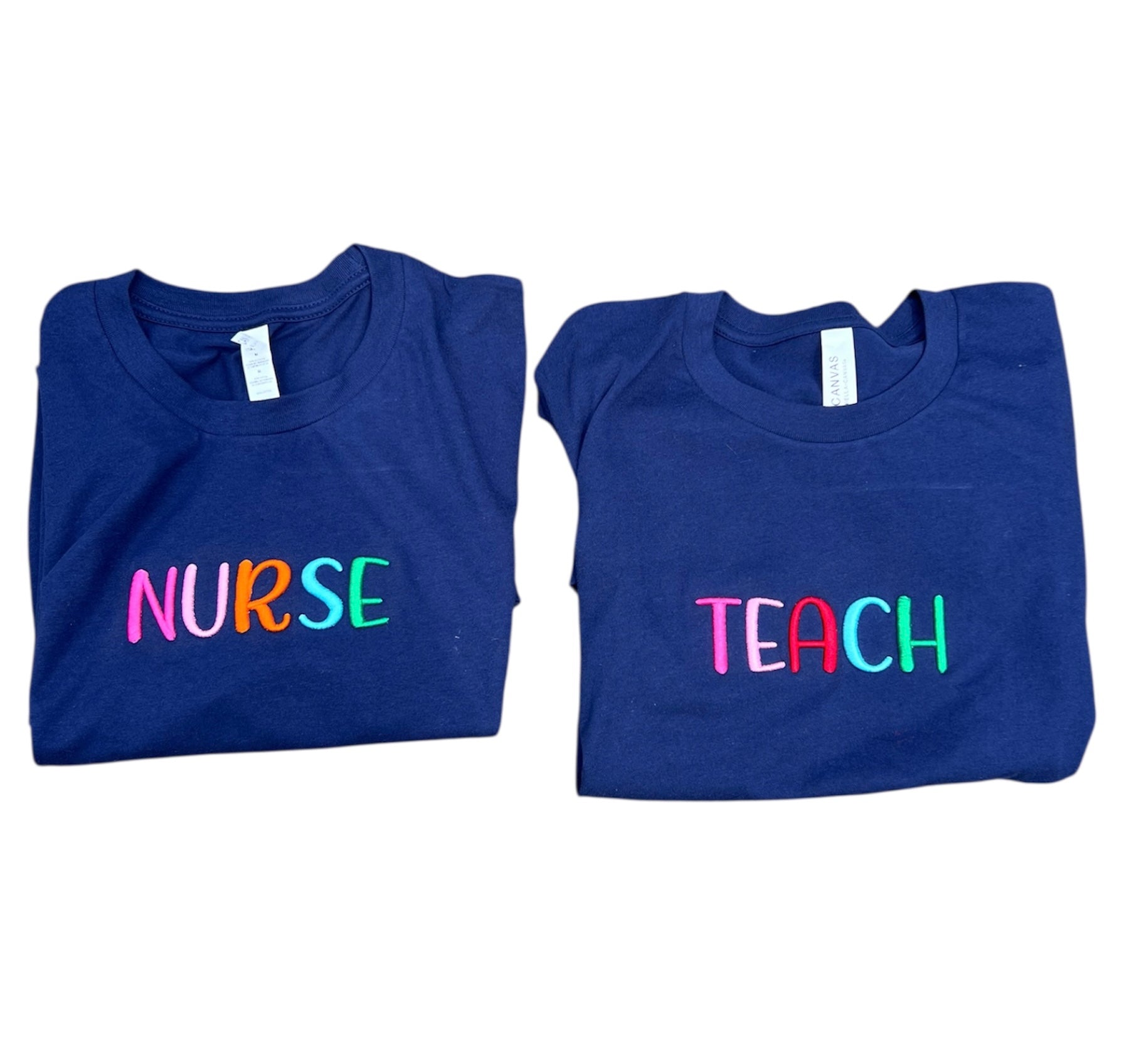 Two blue t-shirts with 'NURSE' and 'TEACH' text on a white background