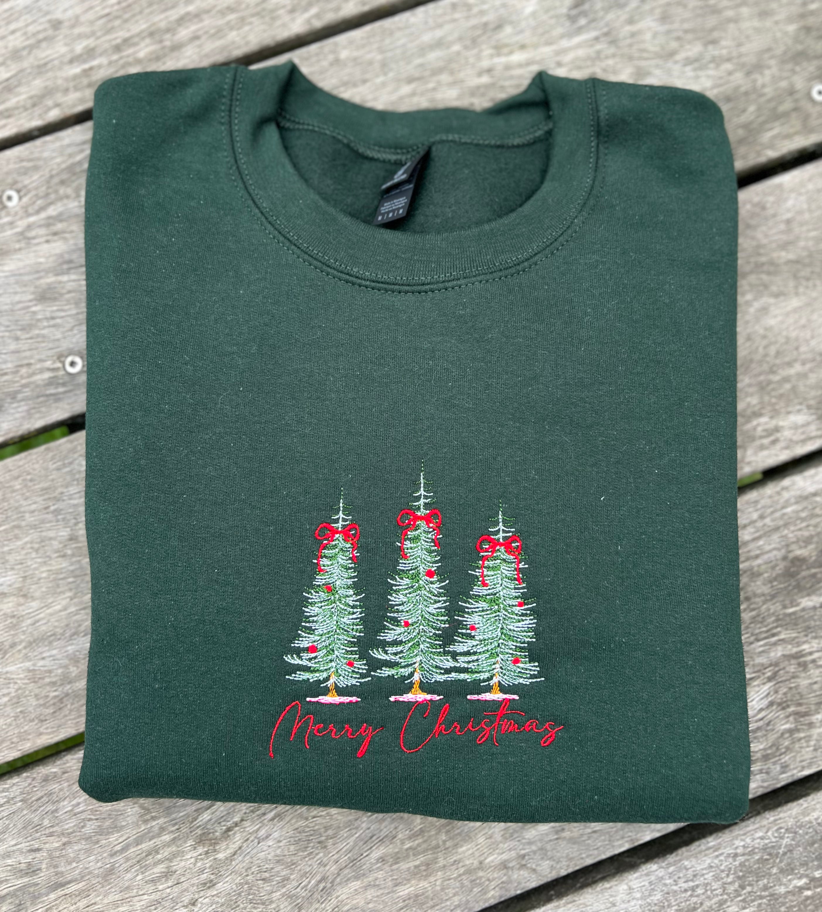 merry christmas embroidered sweatshirt with pine trees in forest green color